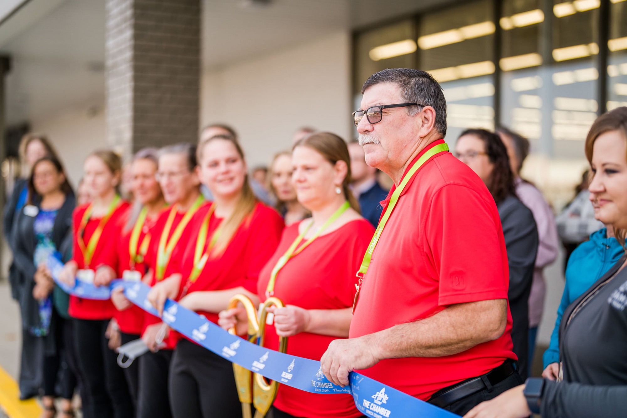Burke's Outlet Home Centric Celebrate Grand Opening with Ribbon